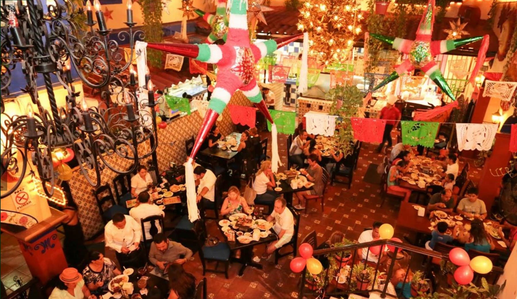 Local taco restaurant atmosphere on Avenida Yaxchilán in Cancun