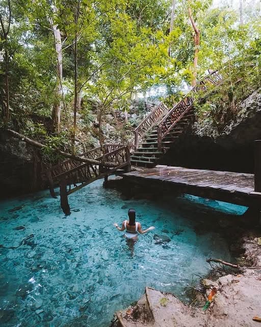 bright blue water inside Gran Cenote Tulum